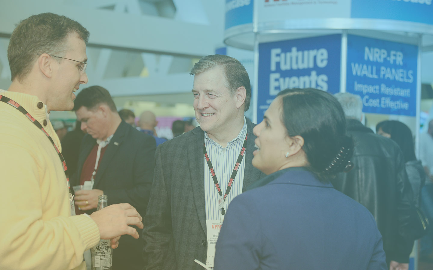 NFMT Attendees Smiling and Talking at Networking Party
