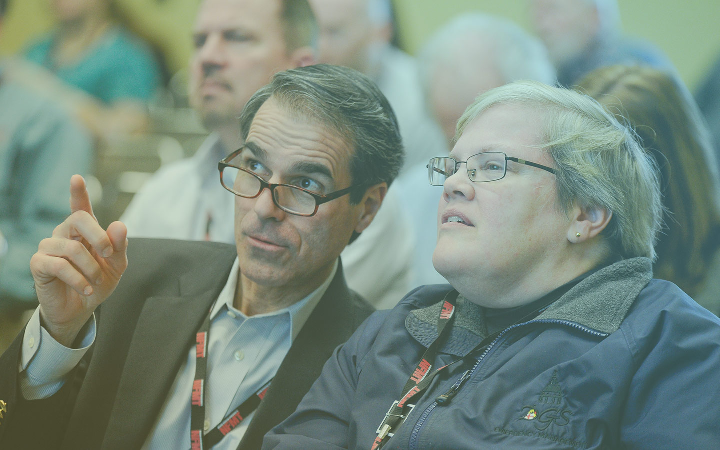 NFMT Session Attendees Pointing to Screen
