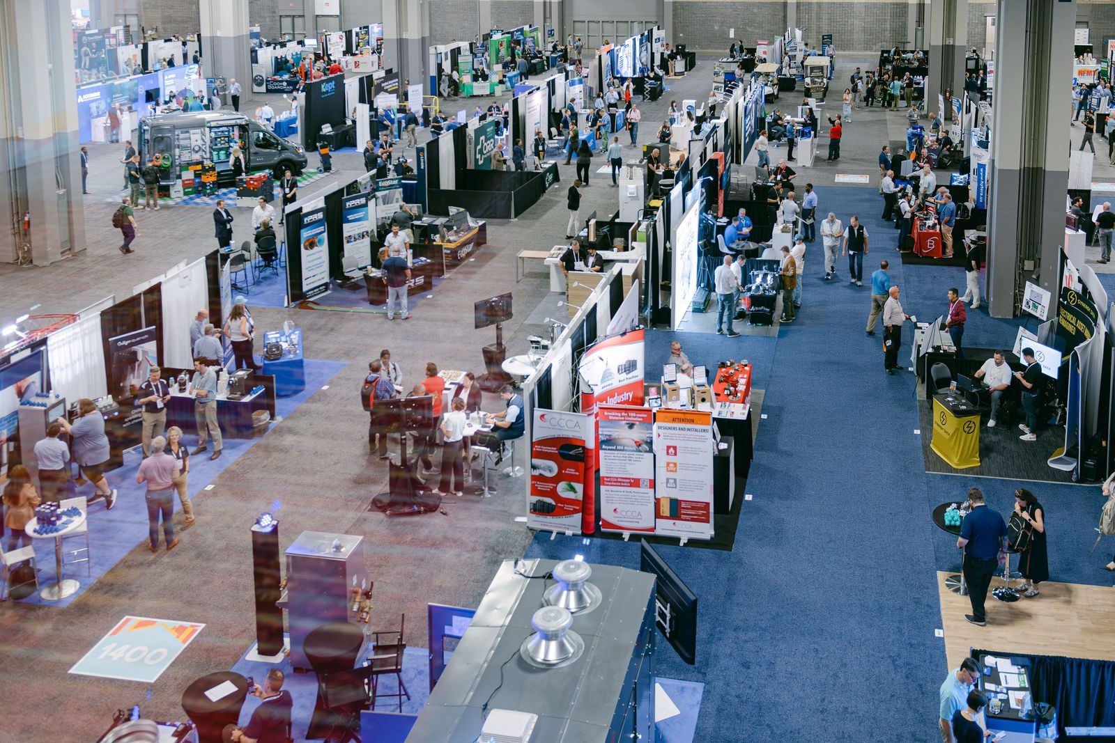 Overhead view of the NFMT expo floor filled with exhibitor booths and attendees