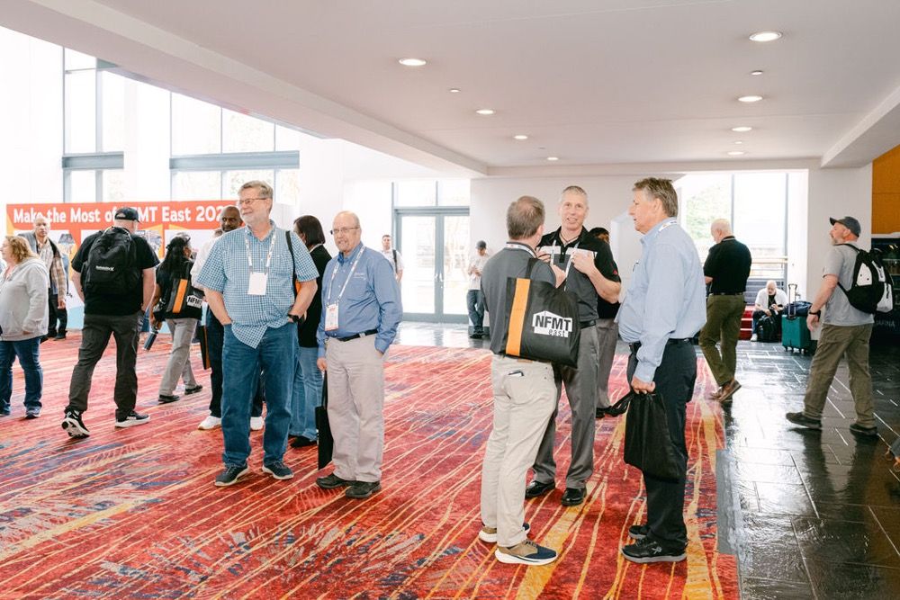 Facilities professionals networking during the event