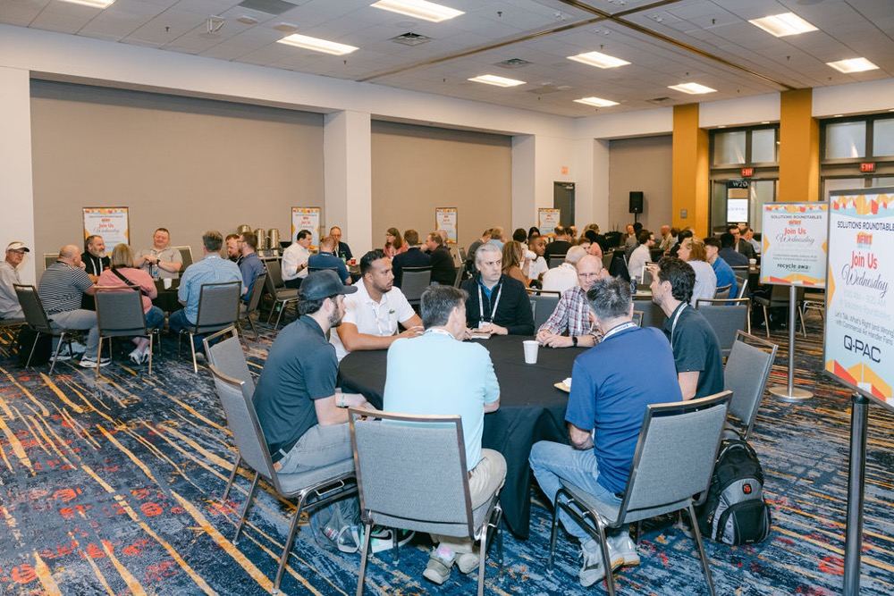 Facilities professionals collaborating in an NFMT conference session