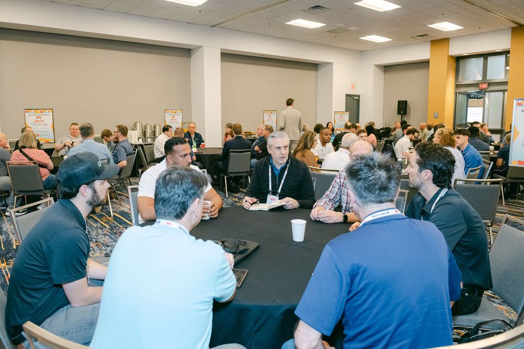 Facilities professionals in a packed education session