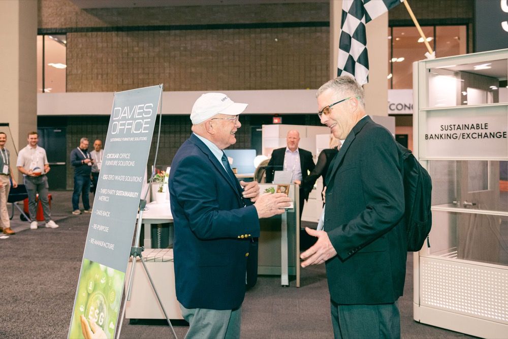 Attendees connecting at an exhibitor booth